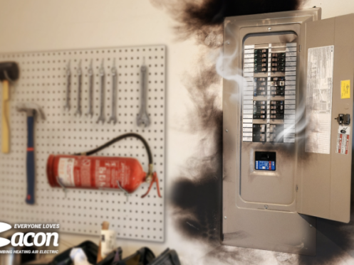 Smoke emerges from an electrical panel with visible circuit breakers next to a wall-mounted tool board holding various tools and a fire extinguisher. The Bacon Plumbing Heating Air Electric logo appears in the lower-left corner.